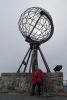 Pat poses under the Globe Device with the midnight sun in the background - before the storm broke